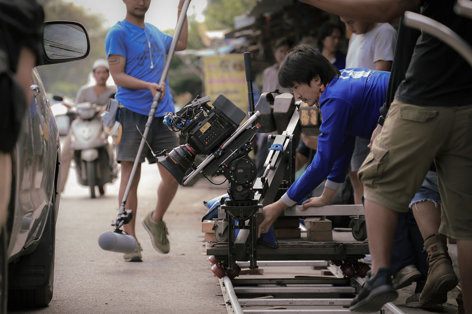 Camera lens recording and crew setup on set
